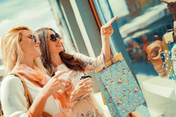 two girls window shopping